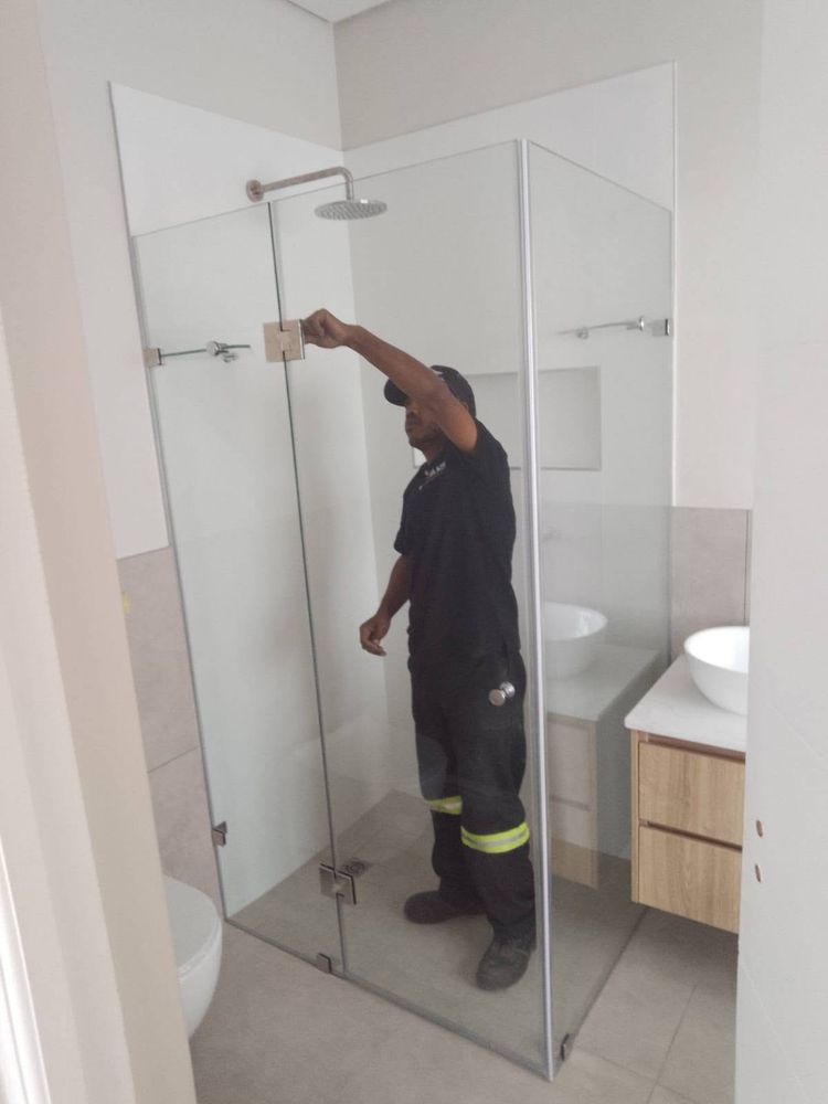 Shower screen being fitted by our installer