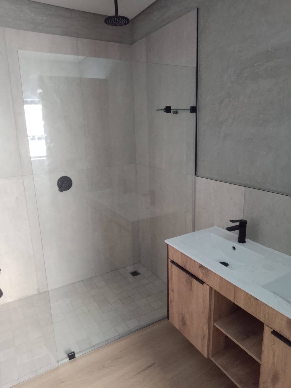 Fixed walk-in shower panel