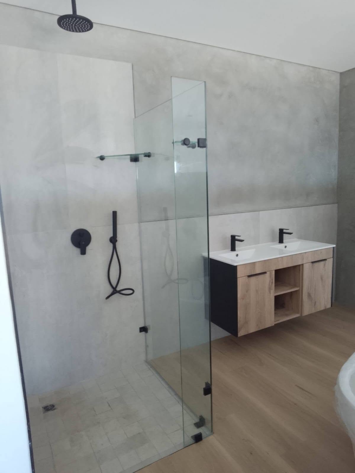 Walk-in shower with black fittings